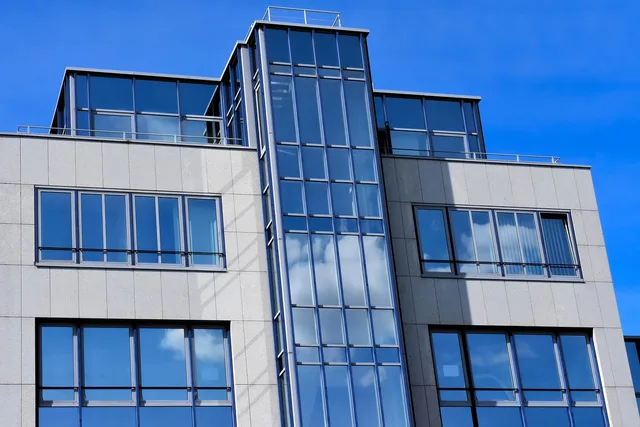 house, glass, architecture, reflection, modern, window, building, property, city, structure, design, facade. Scoping an AI pilot for property video with a manual baseline and stop rules